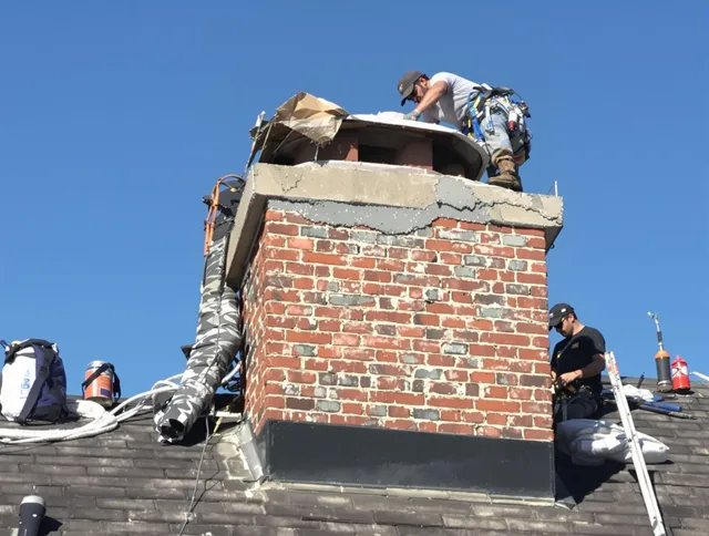 Santa Ana Chimney Sweep installing a custom chimney crown in Santa Ana, CA
