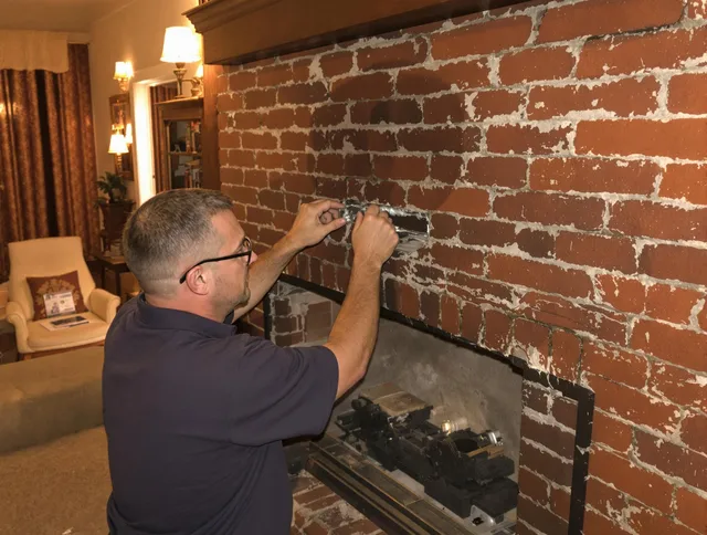 Santa Ana Chimney Sweep expert fixing a fireplace in Santa Ana, CA